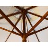Strong wooden ribs supporting the canopy of the 2.5m natural wood parasol