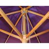 Strong wooden ribs supporting the canopy of the purple wooden parasol
