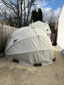 HideyHood 180 light grey Extra Strong storage tent being used to over winter a ride-on mower with snowblower attachment.